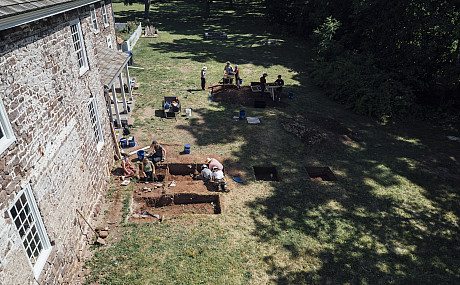 Students and faculty do an archeological dig by the Speakers House in Trappe. July 11, 2024 - Drone Shots