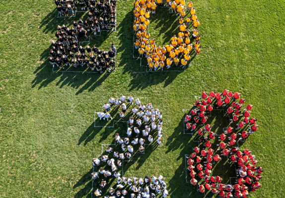 The Class of 2028 in formation on the Intramural Field for the class photo. August 23, 2024