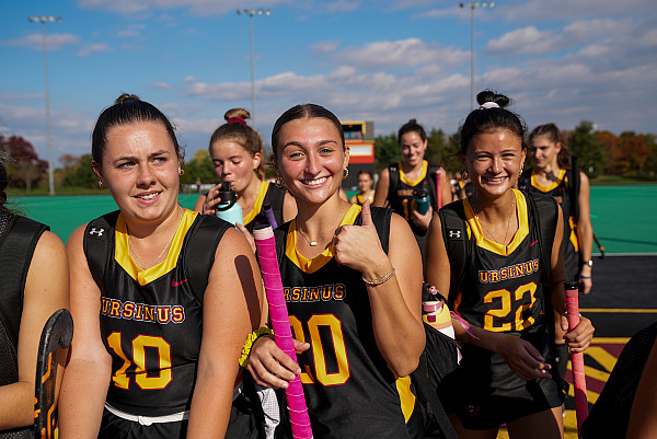 Field Hocket team exiting Snell Field after big win.