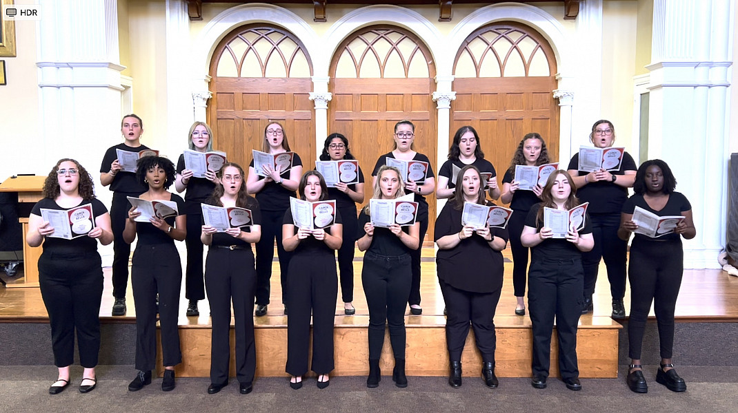 Ursinus College Singers rehearsing in Bomberger Hall Auditorium