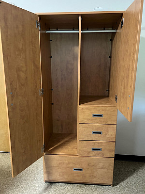 Iinside wardrobe. Wardrobes are only found in triple rooms. Typical triples have 2 closets (with door) and one wardrobe. 