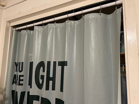 Curtains or shower curtains may be used in singles and doubles to cover open closets. They are approximately 46 wide.