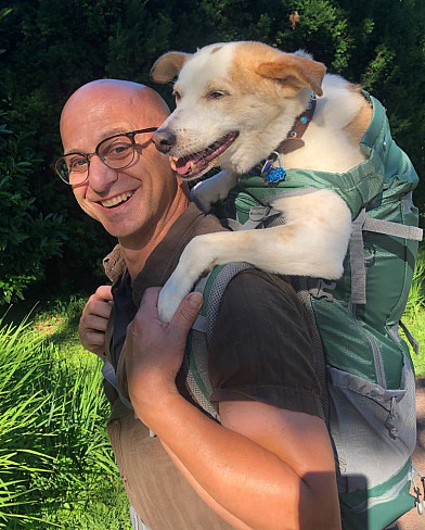 Photo of Prof. Domenick Scudera with his 2-legged dog, Lucky