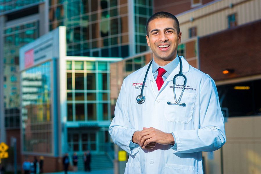 Dr. Aakash Shah poses for a photograph outside Robert Wood Johnson Hospital.