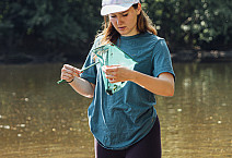 Emily Lybashev collecting and measuring crayfish in the Perkiomen Creek for research. - June 25, 2024