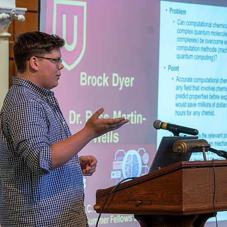 Brock Dyer presents his Summer Fellows research in Bomberger Hall.
