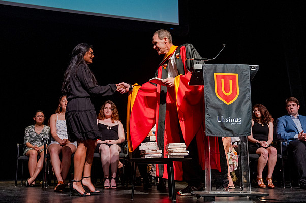 Mark Ellison, the David Laucks Hain professor of chemistry and president of Ursinus's chapter of Phi Beta Kappa, presides over the induct...