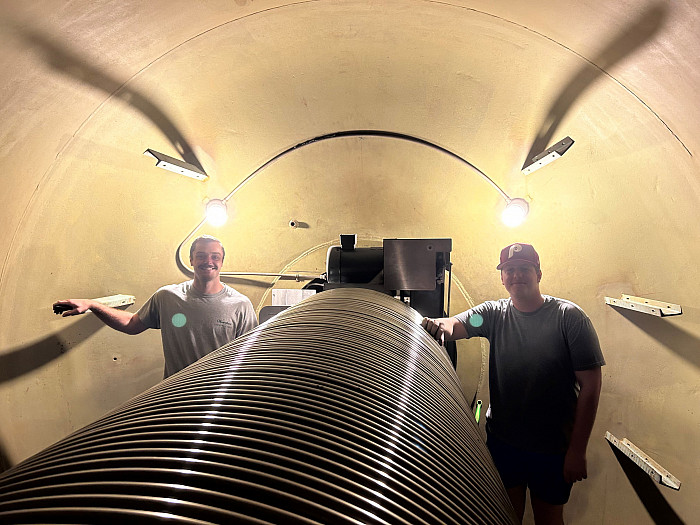 Mill Heinze '24 and Ian Conroy '24 inside the Tandem Van de Graaff accelerator at Florida State University helping repair the charging sy...