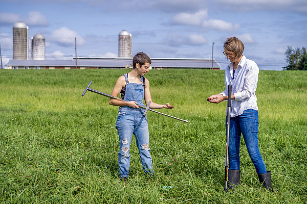 Dr. Denise Finney and undergraduate researcher, Madi Moses, examine a soil sample collected from the forage crop diversity experiment at ...