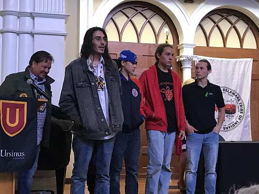 Group of students giving a speech at the Delaware Tribe of Indians event.