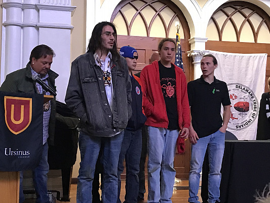 Group of students giving a speech at the Delaware Tribe of Indians event.