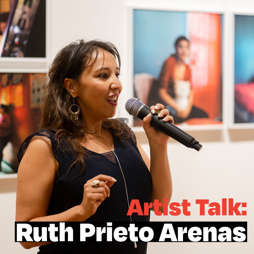 Ruth talk YouTube-2 (2) Ruth Prieto Arenas speaking in front of her displayed photographs.