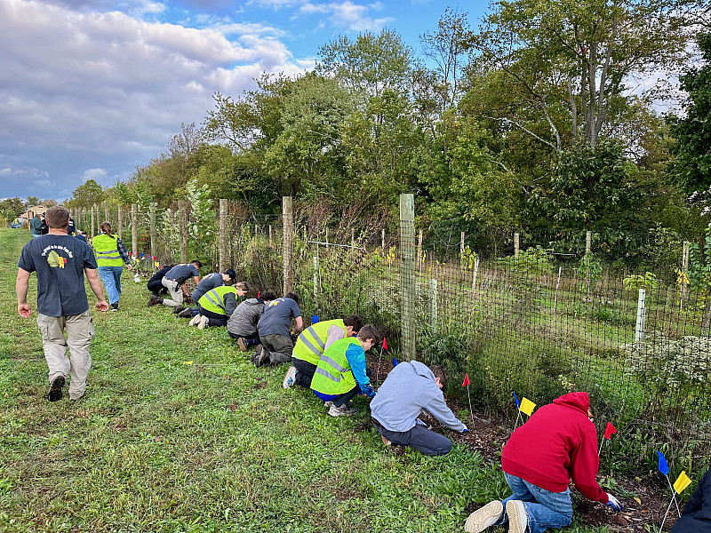 Students plant culturally and ecologically important species at the food forest.