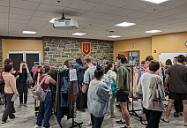 Students shopping for clothes at BearShare pop-up.