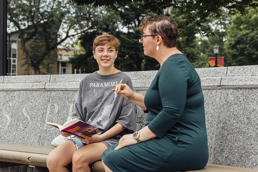 Dr. Kara McShane mentors summer fellow, Amber Leech '25 who spent their  experience researching queer coding in film.