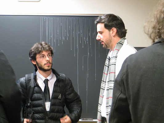 Elijah Sloat discusses his paper with Dr. Alex Novikoff, Fordham University.