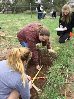 Students in Professor Katharine Davis's Introduction to Forensic Anthropology class spend a lab outdoors.