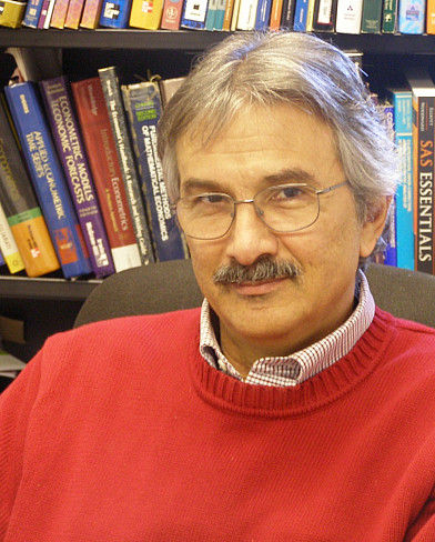 Photo of Andrew Economopoulos in a library