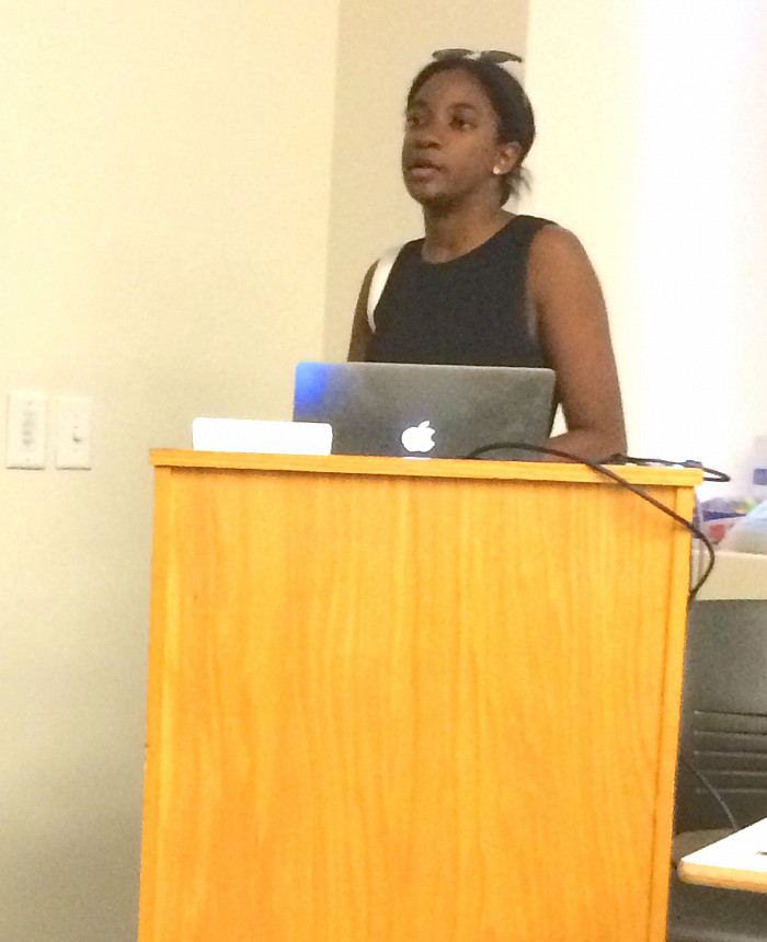 Chelsey Thomas presenting her work on first-generation immigrants in higher education