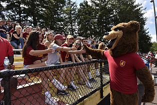 UC mascot handing out high fives