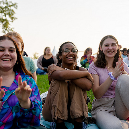 Students enjoying a performance on the Berman Museum lawn.