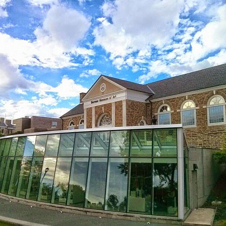 Berman Museum of Art captured against, and reflecting, a baby blue sky in early September