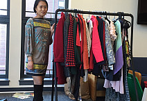 Senior Rebecca Fong shows off some of the hundreds of clothes donated for a fashion show this Sunday. Proceeds go toward helping educate ...