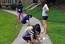 Students from Tohoku Gakuin University are completing a photography project making bookbags.