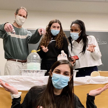 A science experiment with (back row) Professor Mark Ellison, Zenya Yanoff, Abigail Coachi and (front) Kathryn Bjorkund.