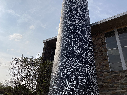 The Ursinus smokestack is transformed into a mural by Brooklyn artist Katie Merz.