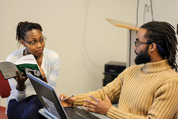 Edward Onaci, Assistant Professor of History discusses talks with Rachael Carter '18 during his class on colonialism in Kenya.