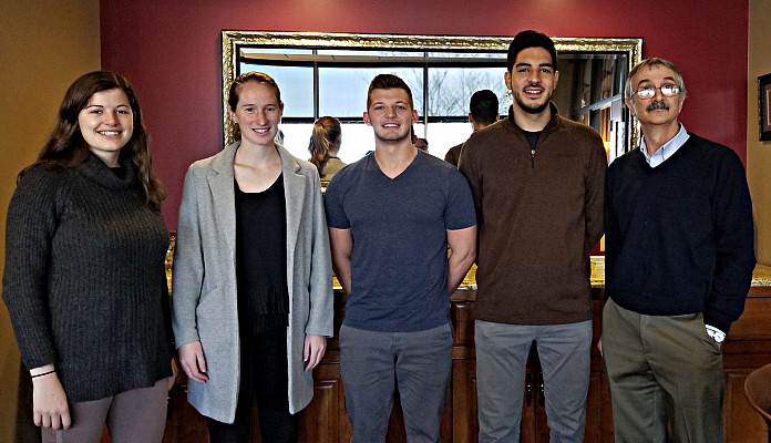 Gemma Dufoe '20, Bridget Sherry '19, Brett Korn '20 and Jorge Arrisueno '20 (pictured left to right with Professor Andrew Economopoulos) ...