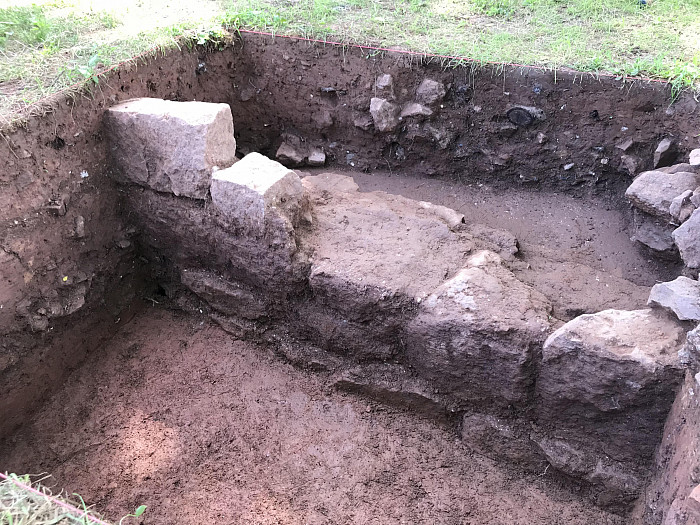 One of the many projects the summer students focused on was uncovering the original barn walls that remain underground.