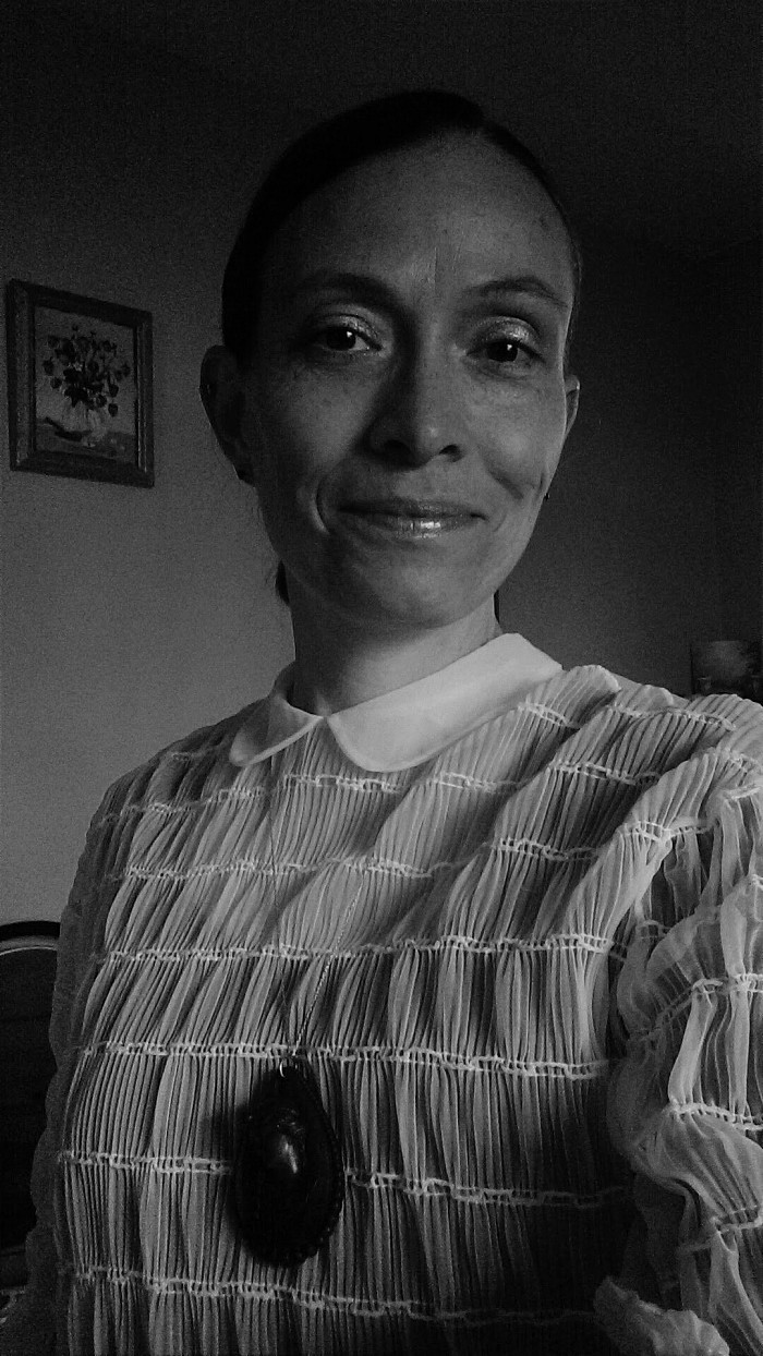 Holly Hubbs wearing a 70-year-old blouse and a 100-year-old pendant