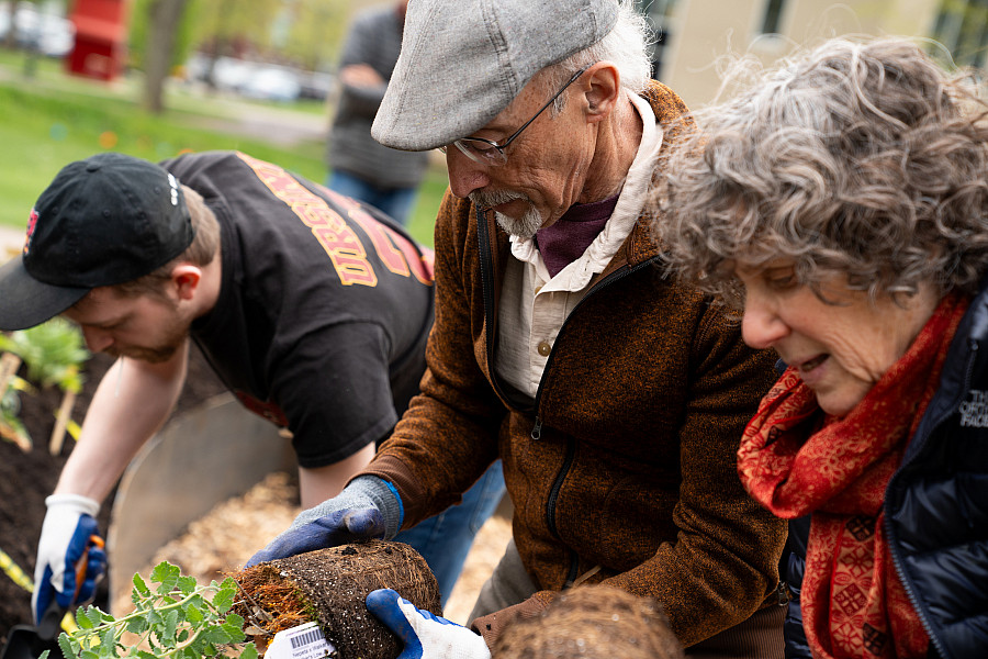Alumni volunteers help plant the Hugel Garden in April 2024. There are many  ways to make an impact. Get involved today!