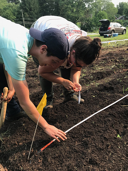 Madi Moses and Kait Lawrence planting crops