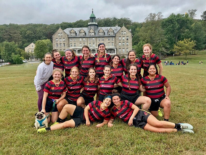 Womens rugby posing after a weekend tournament.