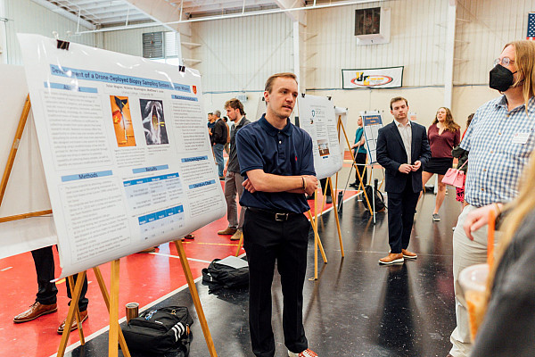 Marine science student presenting research to others.