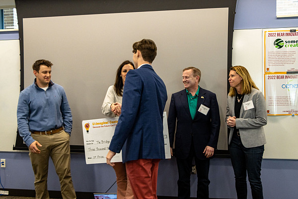 Trevor receiving his check for 1st Place