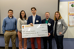Trevor Mislan '23 receiving his check from the Judges
